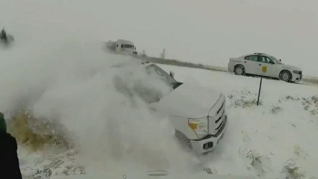 Dramatic video, truck crashes off road near trooper