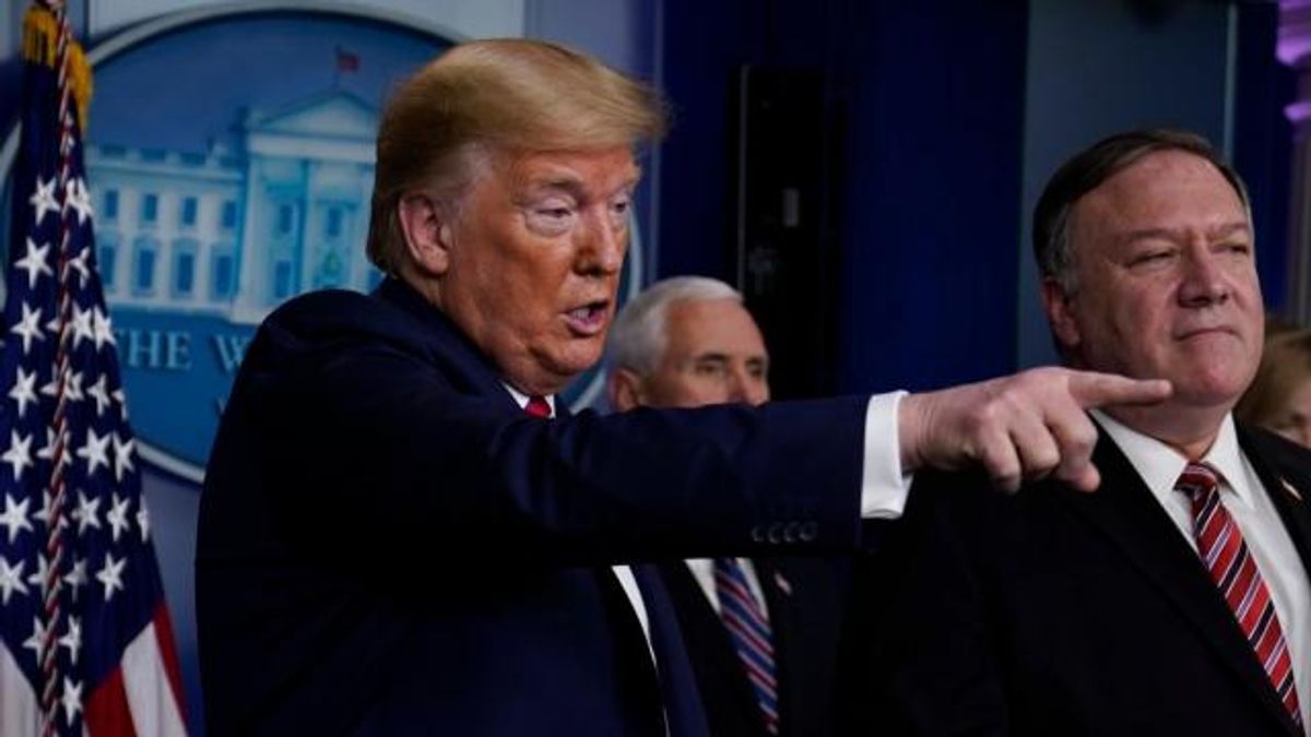 Secretary of State Mike Pompeo listens as President Donald Trump speaks during a coronavirus task force briefing at the White House, Friday, March 20, 2020, in Washington. 