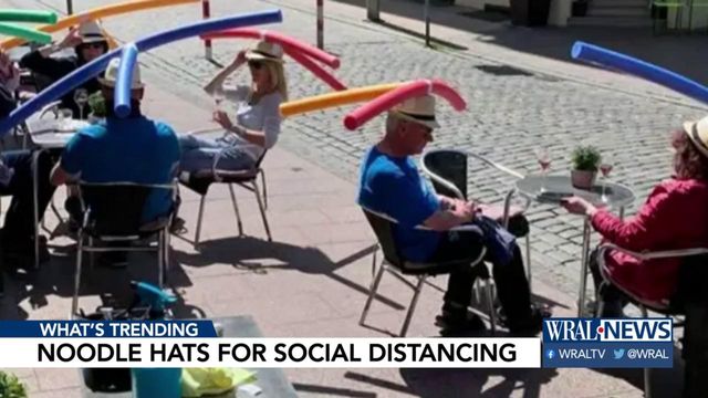 German cafe uses pool noodles as hats to enforce social distancing