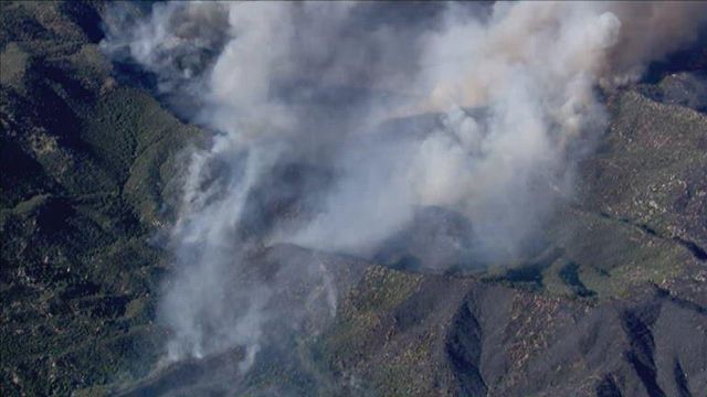 Firefighters struggle to control large brush fire in Arizona
