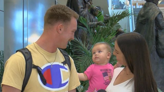 Happy homecoming: Soldier meets daughter for first time