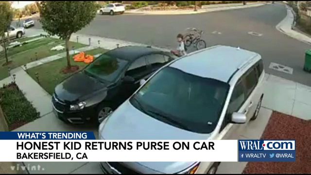 Child's good deed to return purse caught on security camera