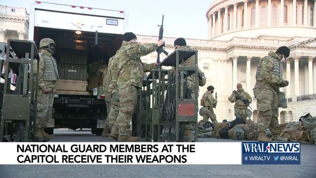 National Guard members at Capitol receive their weapons 