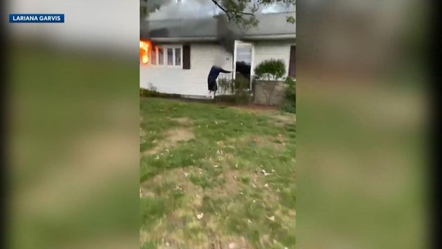 On cam: 97-year-old woman rescued from burning home