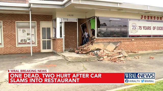 One killed when driver crashes SUV into restaurant