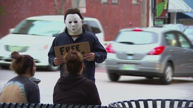 Man dressed as Michael Myers gives hugs to spread the love