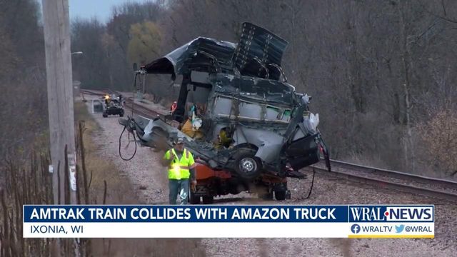 Amazon truck sliced in half by train; driver survives