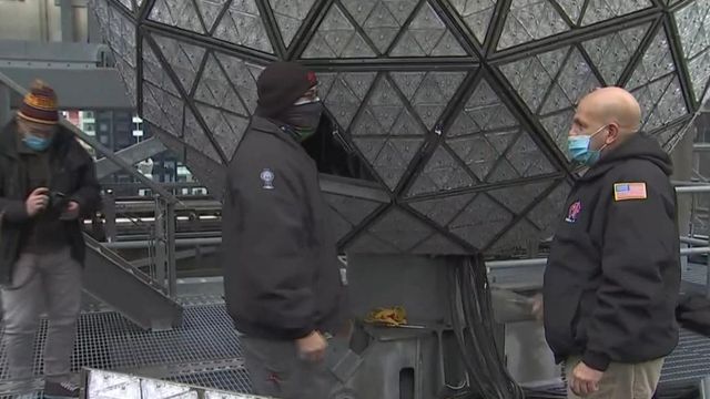 Workers in Times Square installing 192 new crystals on New Year's Eve ball 