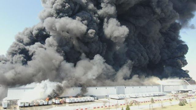 Huge plumes of smoke hover over Walmart distribution center fire