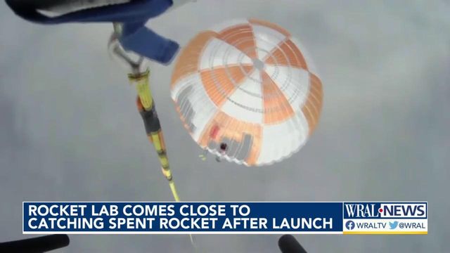 Rocket Lab briefly catches rocket falling from space with helicopter