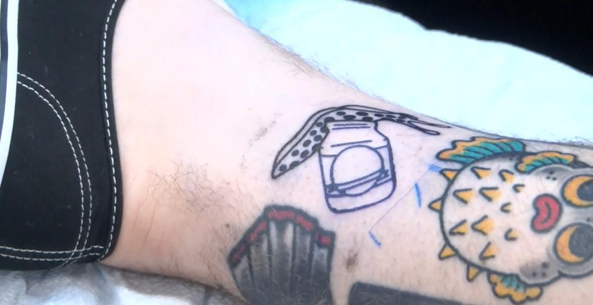 Restaurant offers free burgers for a year if you get a tattoo for life | CNN
