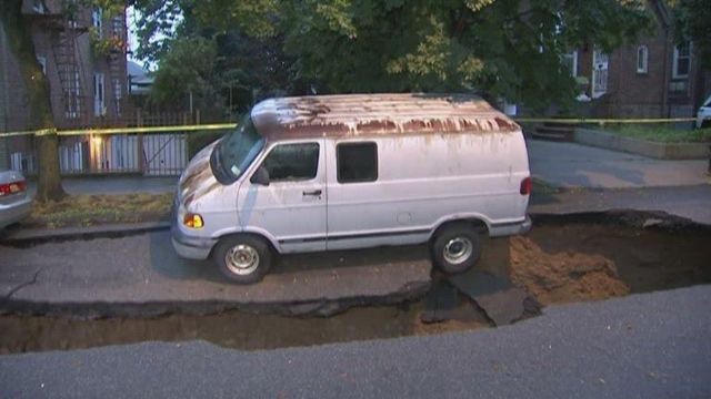 Van falls into NYC sinkhole on camera