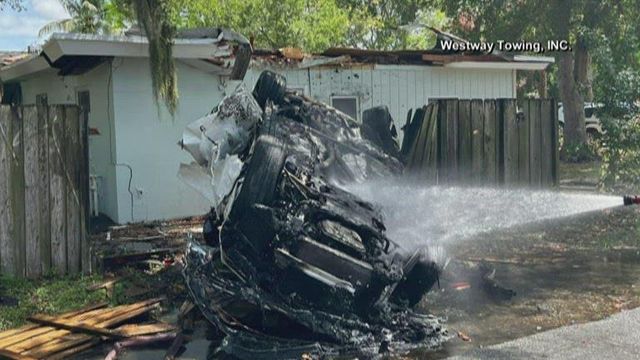 Lamborghini bursts into flames after landing on roof of home
