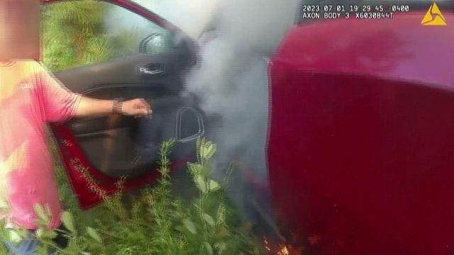 Deputy saves woman from burning car after crash