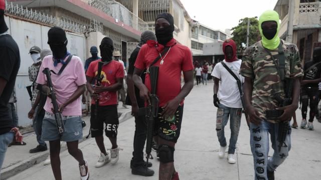 Armed members of "G9 and Family" march in a protest against Haitian Prime Minister Ariel Henry in Port-au-Prince, Haiti, Tuesday, Sept. 19, 2023. (AP Photo/Odelyn Joseph)