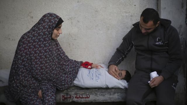 Palestinians mourn a child killed in the Israeli bombardment of the Gaza Strip at a hospital morgue in Rafah, Monday, Feb. 12, 2024. (AP Photo/Hatem Ali) Palestinians mourn a child killed in the Israeli bombardment of the Gaza Strip at a hospital morgue in Rafah, Monday, Feb. 12, 2024. (AP Photo/Hatem Ali)