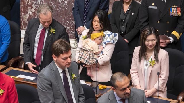 Politician criticized for taking baby to work