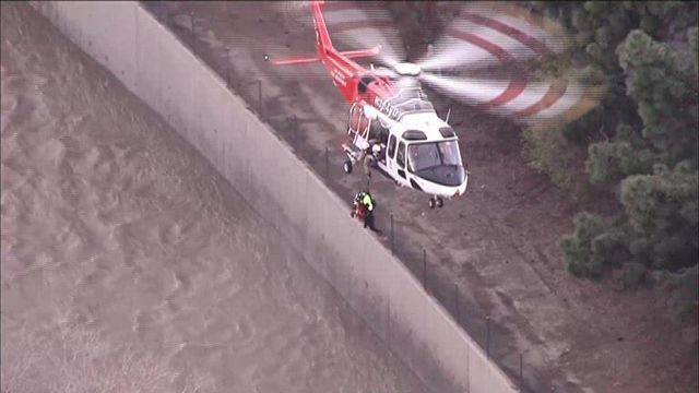 Helicopter rescues woman who fell into Los Angeles River