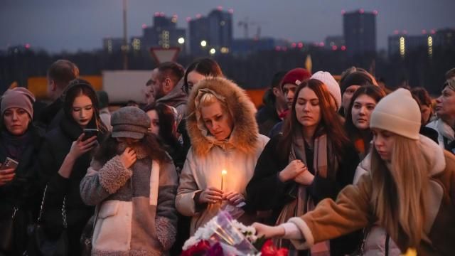 People lay flowers and light candles standing next to the Crocus City Hall, on the western edge of Moscow, Russia, Saturday, March 23, 2024. Russia's top state investigative agency says the death toll in the Moscow concert hall attack has risen to over 133. The attack Friday on Crocus City Hall, a sprawling mall and concert venue on Moscow's western edge, also left many wounded and left the building a smoldering ruin. (AP Photo/Alexander Zemlianichenko) People lay flowers and light candles standing next to the Crocus City Hall, on the western edge of Moscow, Russia, Saturday, March 23, 2024. Russia's top state investigative agency says the death toll in the Moscow concert hall attack has risen to over 133. The attack Friday on Crocus City Hall, a sprawling mall and concert venue on Moscow's western edge, also left many wounded and left the building a smoldering ruin. (AP Photo/Alexander Zemlianichenko)