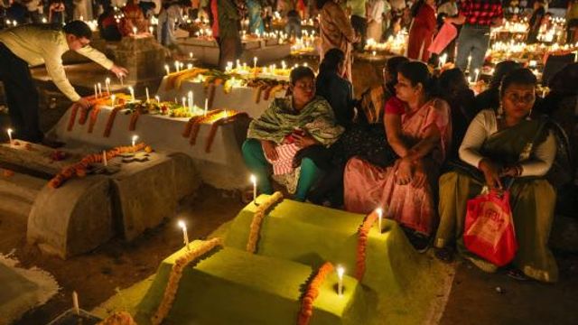 Christian families light candles and put flowers on the graves of their dear ones early morning on Easter in Purulia, West Bengal, India, Sunday, March 31, 2024. Christian around the world are celebrating Easter commemorating the day when according to Christian tradition Jesus was resurrected in Jerusalem two millennia ago. (AP Photo/Bikas Das) Christian families light candles and put flowers on the graves of their dear ones early morning on Easter in Purulia, West Bengal, India, Sunday, March 31, 2024. Christian around the world are celebrating Easter commemorating the day when according to Christian tradition Jesus was resurrected in Jerusalem two millennia ago. (AP Photo/Bikas Das)