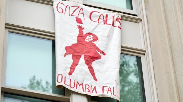 A banner reading “Gaza Calls, Columbia Falls” hangs from a window at Hamilton Hall, an occupied building at Columbia University in upper Manhattan, on Tuesday, April 30, 2024. More protesters were arrested on Tuesday as weeks of tension over pro-Palestinian encampments escalated at campuses across the United States, including at Columbia University, where demonstrators occupied a building and administrators closed the campus to most students and employees. (Bing Guan/The New York Times)