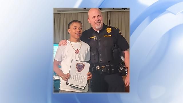 **This image is for use with this specific article only** Acie Holland, 14, is pictured receiving an award from the local police department. This photo is courtesy of Kimberly Holland via CNN Newsource.