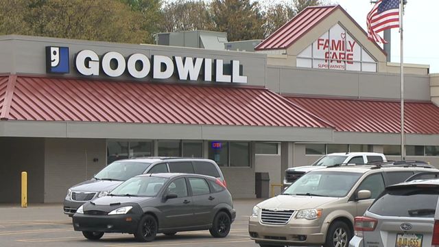 Woman found living inside store sign