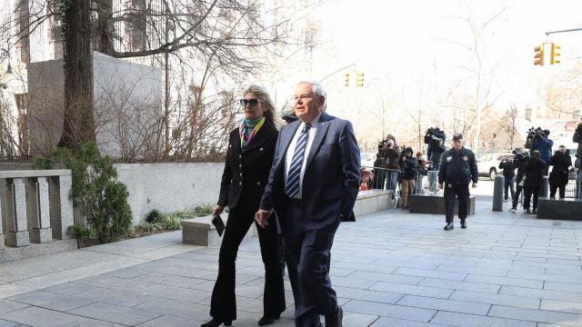 Nadine Menendez and her husband Sen. Bob Menendez (D-N.J.), whose lawyer blamed the senator's wife and her financial troubles for what prosecutors have described as a bribery scheme involving foreign governments, outside the federal district courthouse in Manhattan, March 11, 2024. (Jefferson Siegel/The New York Times)