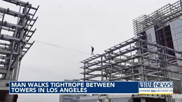 Man walks tightrope between towers in Los Angeles
