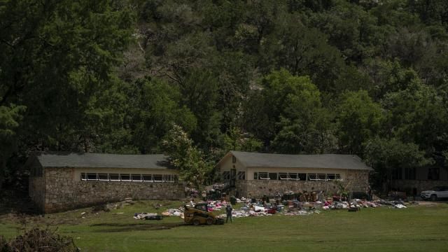 The belongings of campers outside cabins at Camp Mystic in Hunt, Texas, where 27 campers and counselors died in one of the deadliest U.S. floods in decades, July 7, 2025. For decades, Dick and Tweety Eastland presided over Camp Mystic with a kind of magisterial benevolence that alumni well past childhood still describe with awe. (Loren Elliott/The New York Times)