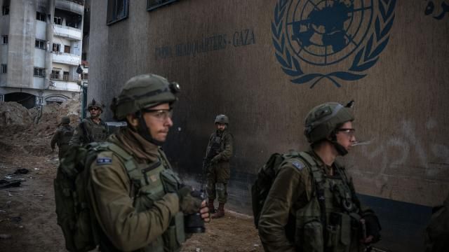 As photographed during an IDF escorted tour, Israeli soldiers outside the headquarters of the United Nations Relief and Works Agency in central Gaza on Feb. 8, 2024. The UNRWA says it has long investigated claims that it was infiltrated by Hamas, firing several employees over the years. Israel calls it a compromised organization, too weak to protect itself. (Sergey Ponomarev/The New York Times)