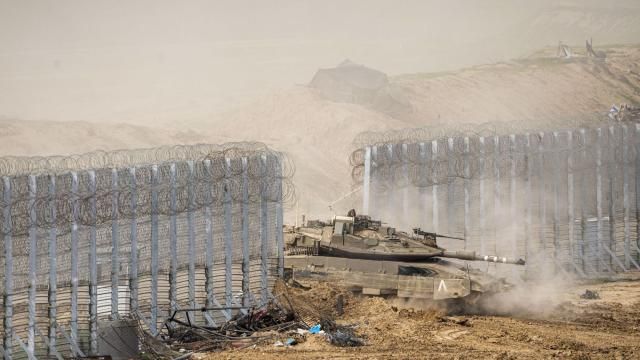Israeli soldiers drive a tank as they cross the border from inside Gaza Strip in to southern Israel, Tuesday, Feb. 13, 2024. The army is battling Palestinian militants across Gaza in the war ignited by Hamas' Oct. 7 attack into Israel. (AP Photo/Ariel Schalit) Israeli soldiers drive a tank as they cross the border from inside Gaza Strip in to southern Israel, Tuesday, Feb. 13, 2024. The army is battling Palestinian militants across Gaza in the war ignited by Hamas' Oct. 7 attack into Israel. (AP Photo/Ariel Schalit)
