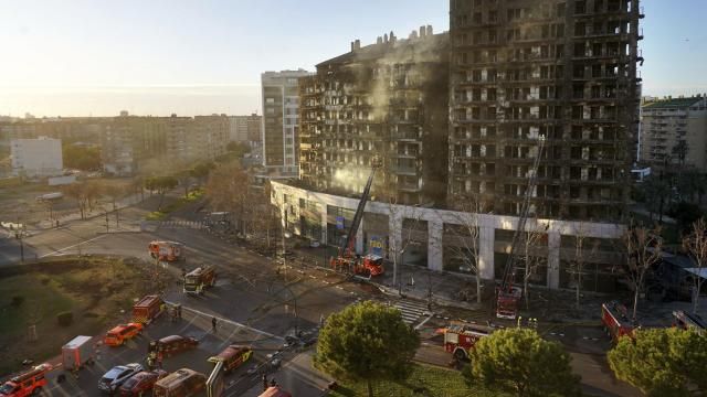 Firefighters work at a burned block building in Valencia, Spain, Friday, Feb. 23, 2024. A fire has engulfed two residential buildings in the eastern Spanish city of Valencia, killing at least four people and injuring at least 13 others. Emergency services reported that at least 19 people were still missing several hours after the fire started. (AP Photo/Alberto Saiz) Firefighters work at a burned block building in Valencia, Spain, Friday, Feb. 23, 2024. A fire has engulfed two residential buildings in the eastern Spanish city of Valencia, killing at least four people and injuring at least 13 others. Emergency services reported that at least 19 people were still missing several hours after the fire started. (AP Photo/Alberto Saiz)