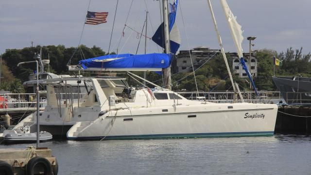 The yacht "Simplicity", that officials say was hijacked by three escaped prisoners with two people aboard, is docked at the St. Vincent and the Grenadines Coastguard Service Calliaqua Base, in Calliaqua, St. Vincent, Friday, Feb. 23, 2024. Authorities in the eastern Caribbean said they were trying to locate two people believed to be U.S. citizens who were aboard the yacht that was hijacked by the three escaped prisoners from Grenada. (AP Photo/Kenton X. Chance) The yacht "Simplicity", that officials say was hijacked by three escaped prisoners with two people aboard, is docked at the St. Vincent and the Grenadines Coastguard Service Calliaqua Base, in Calliaqua, St. Vincent, Friday, Feb. 23, 2024. Authorities in the eastern Caribbean said they were trying to locate two people believed to be U.S. citizens who were aboard the yacht that was hijacked by the three escaped prisoners from Grenada. (AP Photo/Kenton X. Chance)