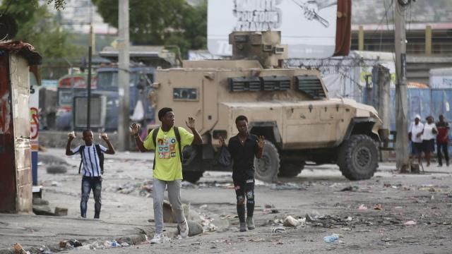 Youths raise their hands to show police they are not carrying weapons during an anti-gang operation at the Portail neighborhood in Port-au-Prince, Haiti, Thursday, Feb. 29, 2024. (AP Photo/Odelyn Joseph) Youths raise their hands to show police they are not carrying weapons during an anti-gang operation at the Portail neighborhood in Port-au-Prince, Haiti, Thursday, Feb. 29, 2024. (AP Photo/Odelyn Joseph)