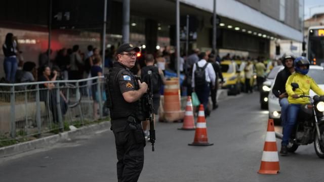 Police patrols outside a bus terminal where police say a gunman wounded two people and took 17 others hostage aboard a bus, in Rio de Janeiro, Brazil, Tuesday, March 12, 2024. (AP Photo/Silvia Izquierdo) Police patrols outside a bus terminal where police say a gunman wounded two people and took 17 others hostage aboard a bus, in Rio de Janeiro, Brazil, Tuesday, March 12, 2024. (AP Photo/Silvia Izquierdo)