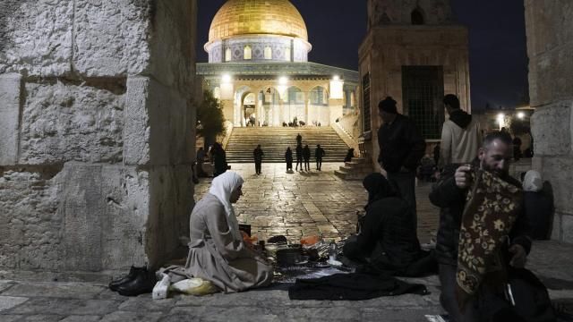 Palestinian Muslims break their fast during the Muslim holy month of Ramadan outside the Dome of Rock at the Al-Aqsa Mosque compound in the Old City of Jerusalem, Saturday, March 16, 2024. (AP Photo/Mahmoud Illean) Palestinian Muslims break their fast during the Muslim holy month of Ramadan outside the Dome of Rock at the Al-Aqsa Mosque compound in the Old City of Jerusalem, Saturday, March 16, 2024. (AP Photo/Mahmoud Illean)