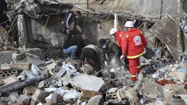 Paramedic workers search for victims in the rubble of a paramedic center that was destroyed by an Israeli airstrike early Wednesday in Hebbariye village, south Lebanon, Wednesday, March 27, 2024. The Israeli airstrike on a paramedic center linked to a Lebanese Sunni Muslim group killed several people of its members. The strike was one of the deadliest single attacks since violence erupted along the Lebanon-Israel border more than five months ago. (AP Photo/Mohammed Zaatari) Paramedic workers search for victims in the rubble of a paramedic center that was destroyed by an Israeli airstrike early Wednesday in Hebbariye village, south Lebanon, Wednesday, March 27, 2024. The Israeli airstrike on a paramedic center linked to a Lebanese Sunni Muslim group killed several people of its members. The strike was one of the deadliest single attacks since violence erupted along the Lebanon-Israel border more than five months ago. (AP Photo/Mohammed Zaatari)