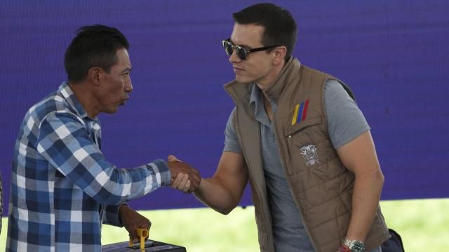 Ecuador's President Daniel Noboa shakes hands with a farmer during his visit to Poalo, Ecuador, Thursday, March 21, 2024, where he met with dairy farmers and handed out 400 land titles. (AP Photo/Dolores Ochoa) Ecuador's President Daniel Noboa shakes hands with a farmer during his visit to Poalo, Ecuador, Thursday, March 21, 2024, where he met with dairy farmers and handed out 400 land titles. (AP Photo/Dolores Ochoa)