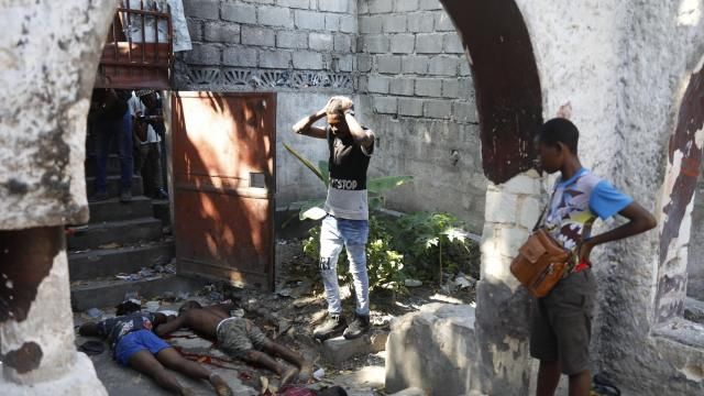 People look at the the bodies of three persons shot dead after an overnight shooting in the Pétion Ville neighborhood of Port-au-Prince, Haiti, Monday, April 1, 2024.(AP Photo/Odelyn Joseph) People look at the the bodies of three persons shot dead after an overnight shooting in the Pétion Ville neighborhood of Port-au-Prince, Haiti, Monday, April 1, 2024.(AP Photo/Odelyn Joseph)