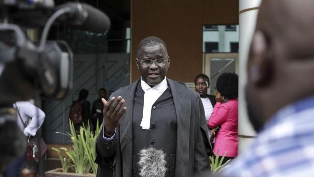 Nicholas Opiyo, Petitioner and Human rights advocate, speaks to journalists outside the Constitutional Court in Kampala, Uganda, Wednesday, April 3, 2024, after Uganda's Constitutional Court gave its seal of approval on the anti-homosexuality law, declaring that the Anti Homosexuality Act of 2023 complies with the Constitution of Uganda. (AP Photo/Hajarah Nalwadda ) Nicholas Opiyo, Petitioner and Human rights advocate, speaks to journalists outside the Constitutional Court in Kampala, Uganda, Wednesday, April 3, 2024, after Uganda's Constitutional Court gave its seal of approval on the anti-homosexuality law, declaring that the Anti Homosexuality Act of 2023 complies with the Constitution of Uganda. (AP Photo/Hajarah Nalwadda )