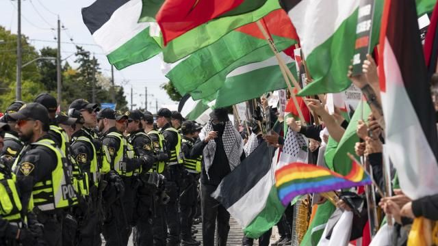 Pro-Palestinian protesters gather along the route of the United Jewish Appeal's annual Walk With Israel march in Toronto, Canada, on Sunday, May 25, 2025. (Arlyn McAdorey/The Canadian Press via AP)