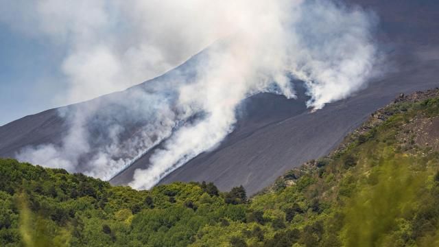 Smoke billows from Mount Etna volcano, Italy, Monday, June 2, 2025. (AP Photo/Giuseppe Distefano)