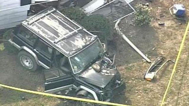 Jeep Slams Into House; Mom, Children Injured