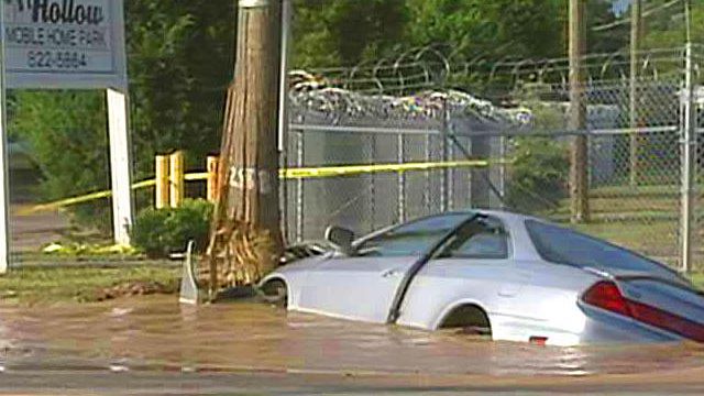 Car gets stuck in Fayetteville sinkhole