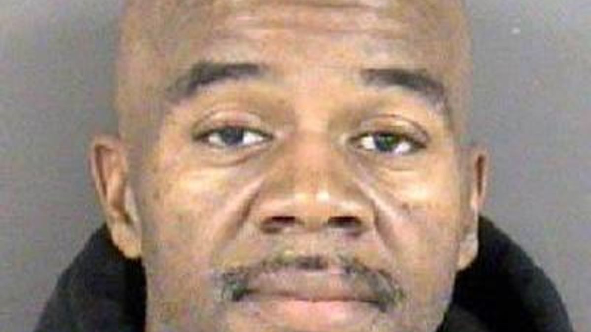 Dennis Simmons, janitor charged with touching student
