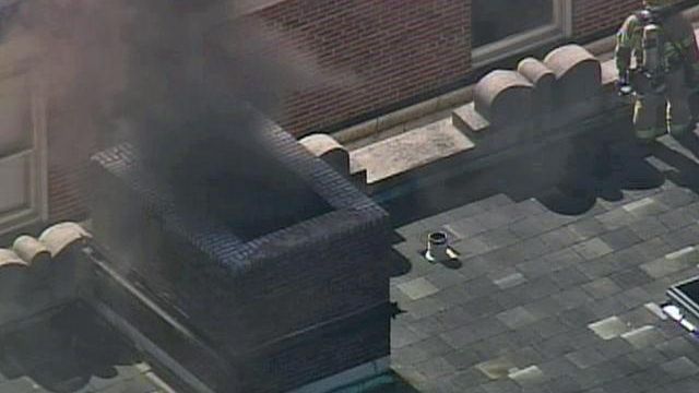 Sky 5 footage smoke from downtown Raleigh building