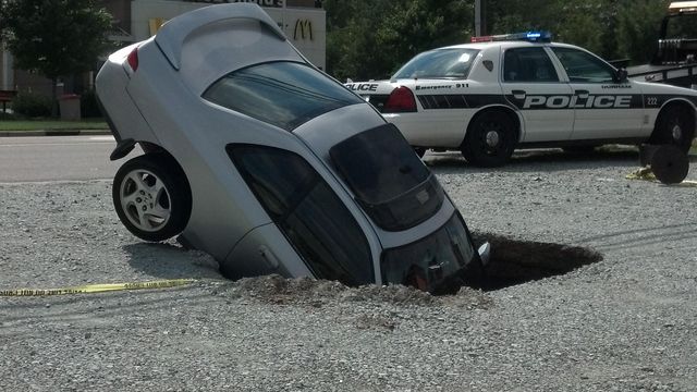 Car nosedives into sinkhole in Durham