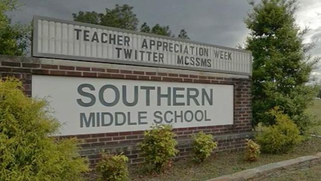 Moore teacher fired, arrested 