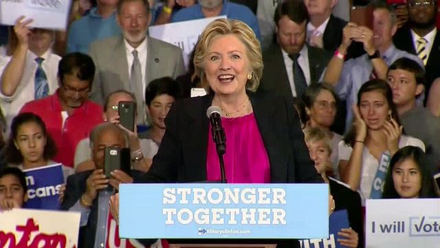 Clinton visits NC wearing big smile